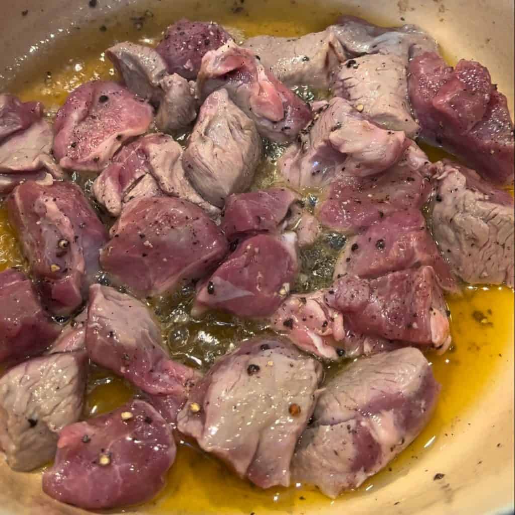 cubed lamb cooking in ghee