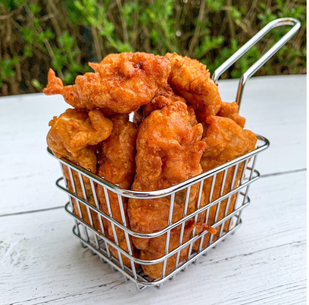 chicken pakora in a wire basket