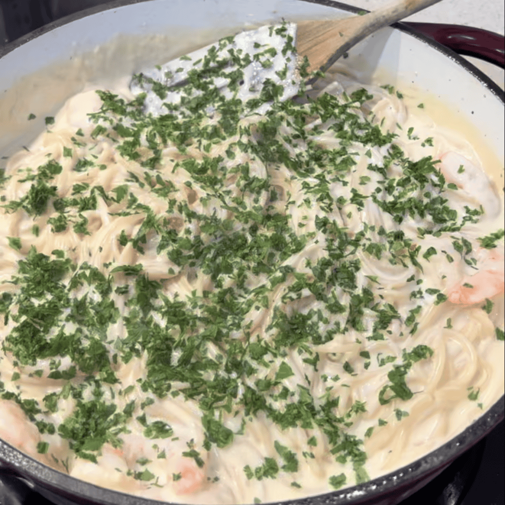 parsley on top of one pan prawn Alfredo