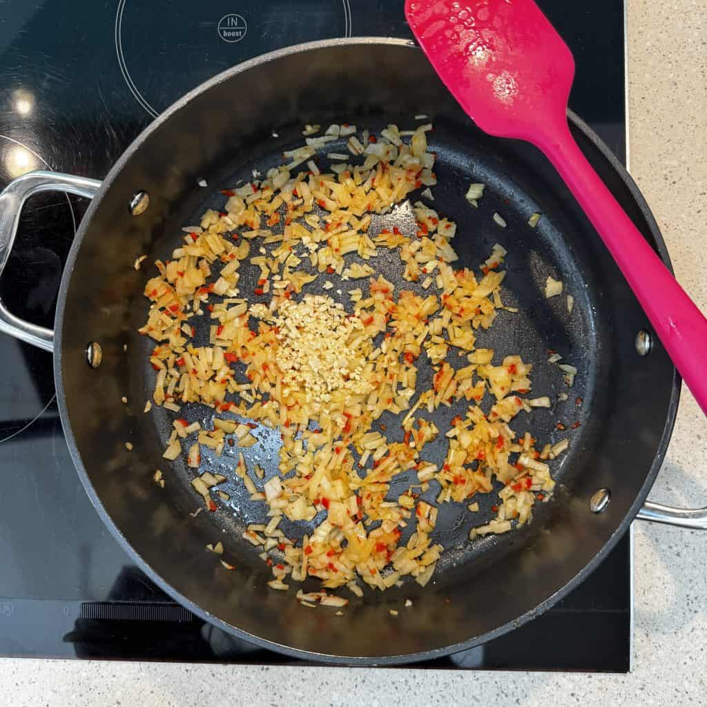 onion, chilli and garlic in oil in a pan