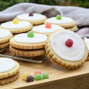 Delicious empire biscuits with white icing and colourful jelly tots, perfect for baking and treats.