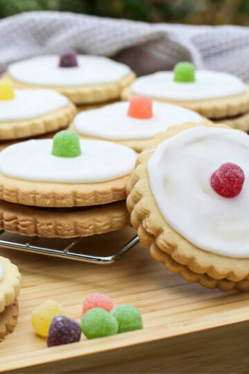 Delicious empire biscuits with white icing and colourful jelly tots, perfect for baking and treats.