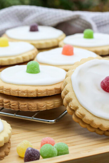 Delicious empire biscuits with white icing and colourful jelly tots, perfect for baking and treats.